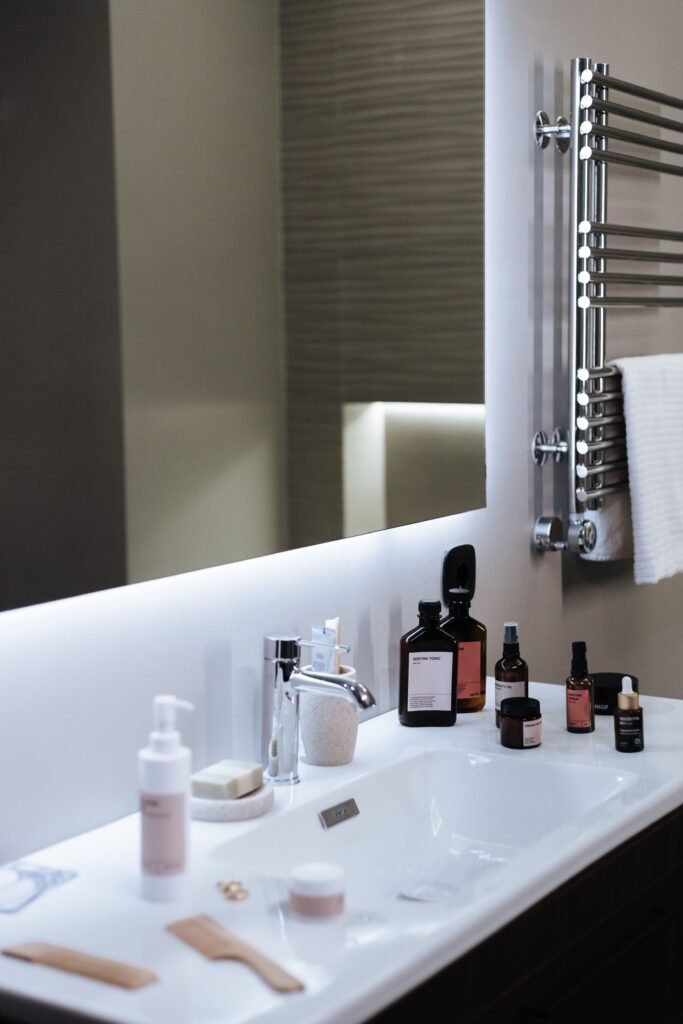 Bathroom hardware wholesale product collection showing faucets, showerheads, towel bars, and toilet paper holders